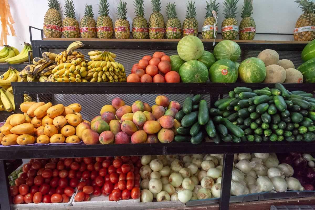 Pineapples, bananas, mangos, tomatoes, yellow and white onions, cucumbers, watermelons, cantaloupes.