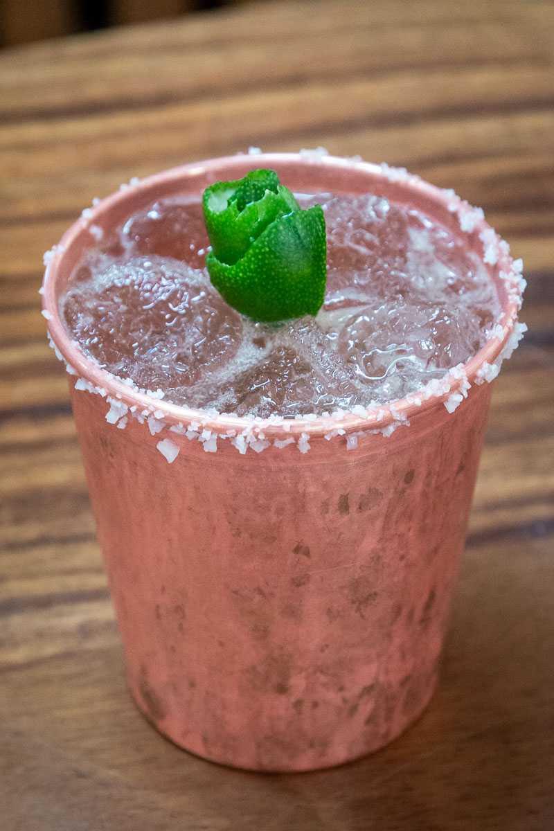 A margarita on the rocks served in a copper cup.