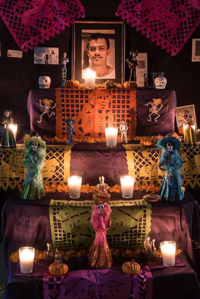 An altar for friends and family members, including a teenager, made by his grandmother, Beatriz.