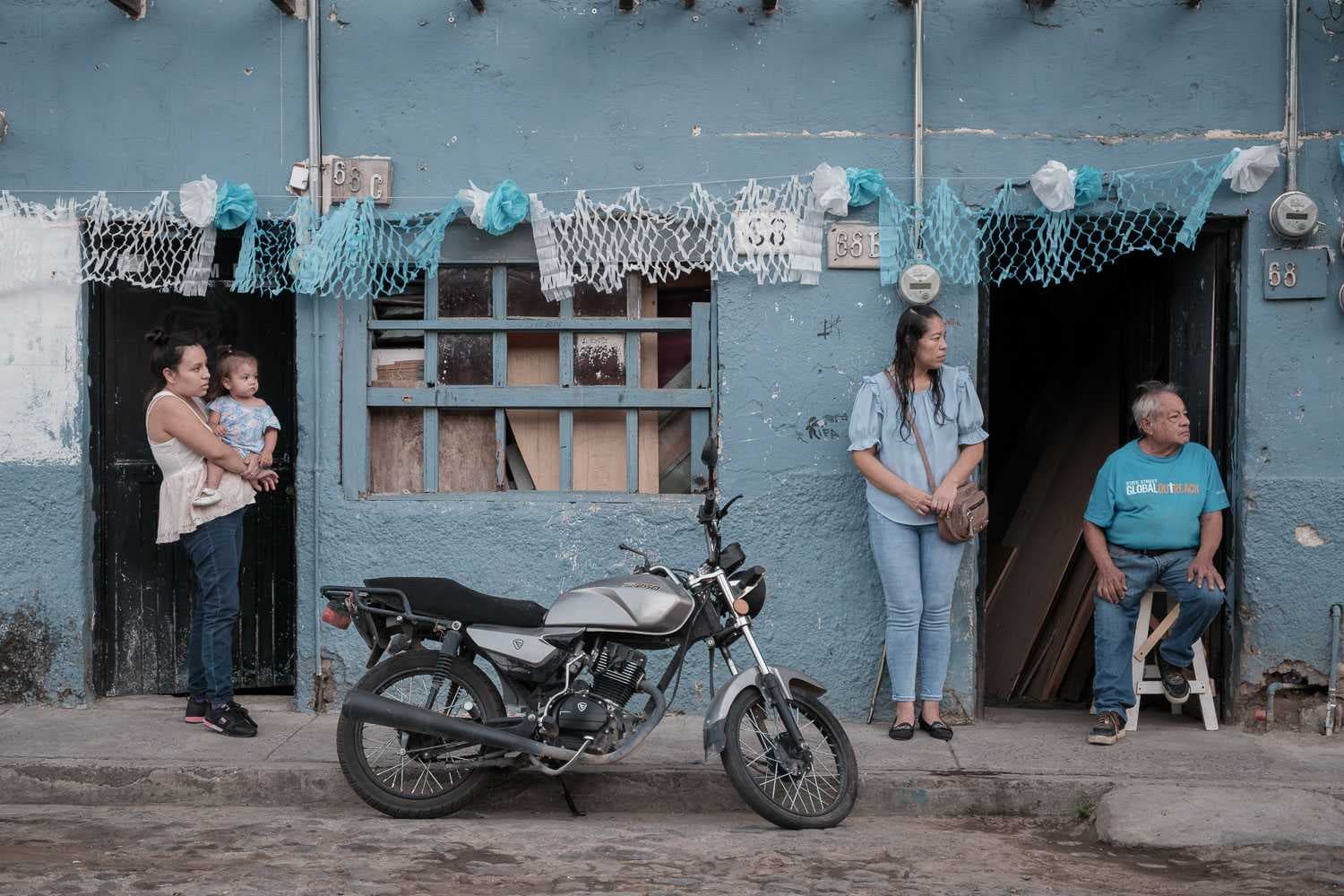 People watch during the procession for Our Lady of the Rosary on October 31.