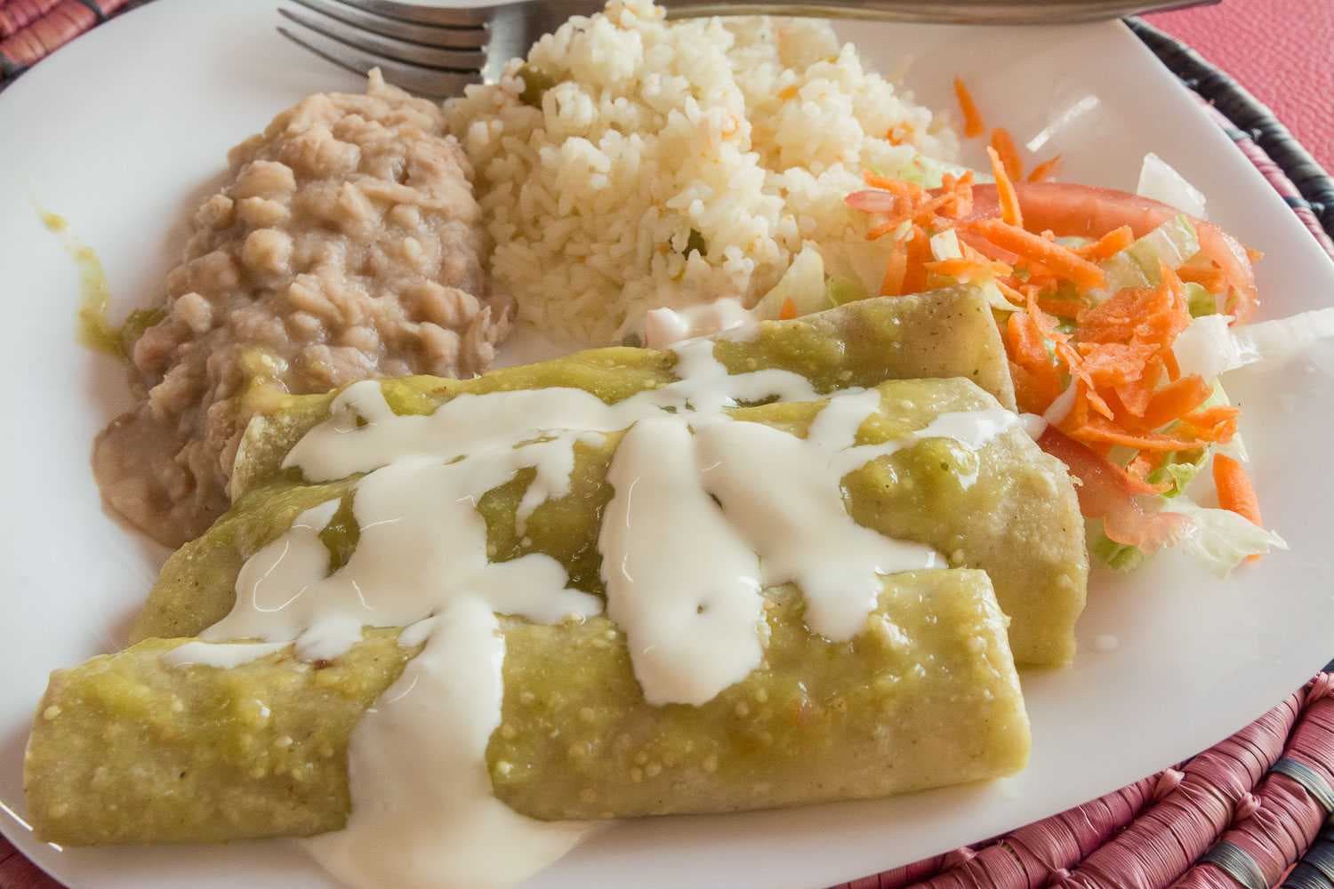 Enchiladas verdes: enchiladas with chicken and a green tomatillo salsa.