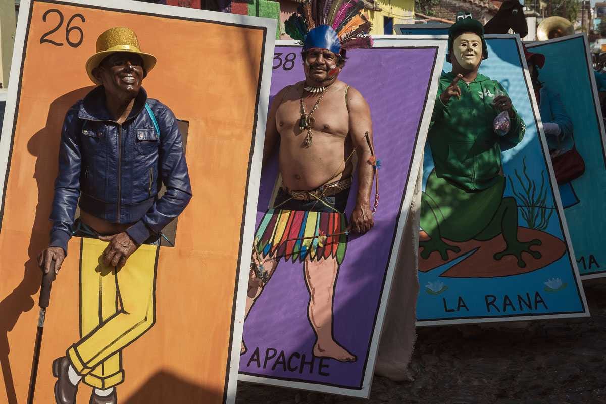 People dressed as human versions of Mexico's famous lottery game, which is kind of like bingo.