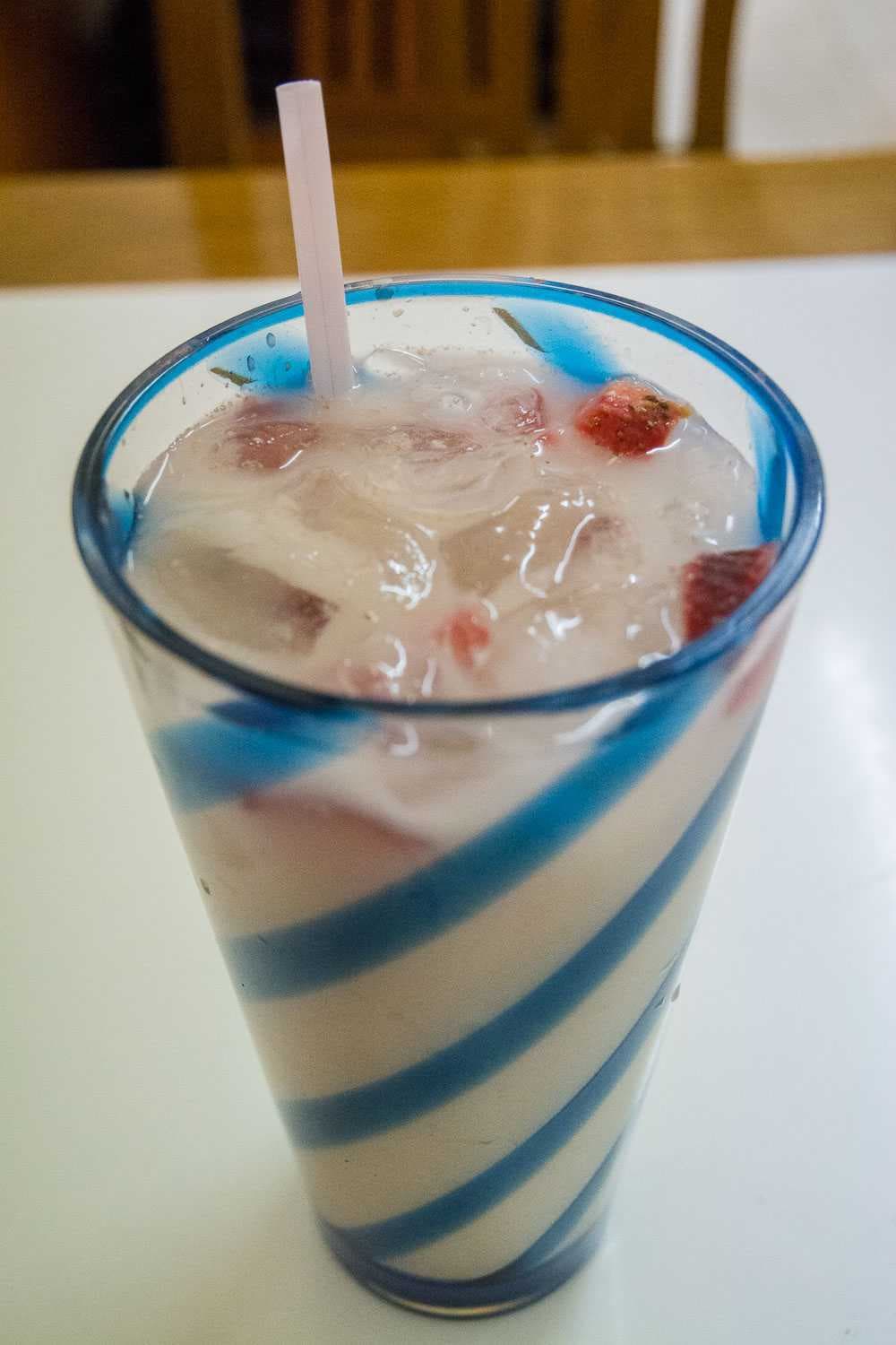 Agua fresca de avena con fresa (water with ground oats and chopped fresh strawberries).