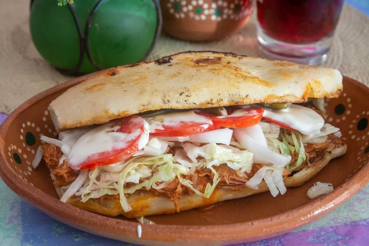 A lonche with pierna (pork leg).